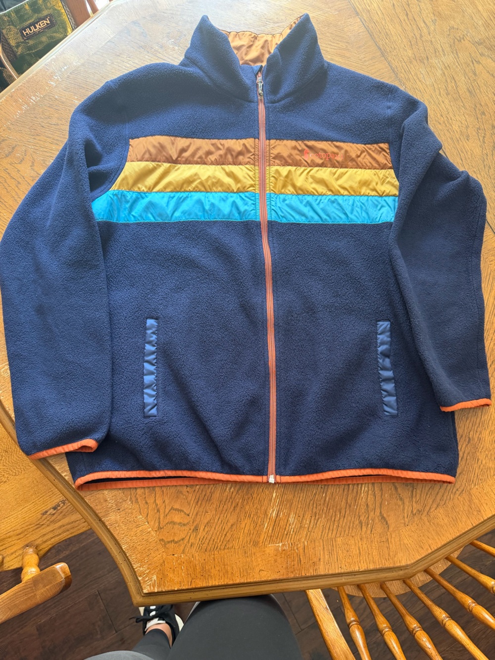 cotopaxi Navy Puffer-Trim Fleece Jacket with Aqua, Mustard, and Brown Stripes